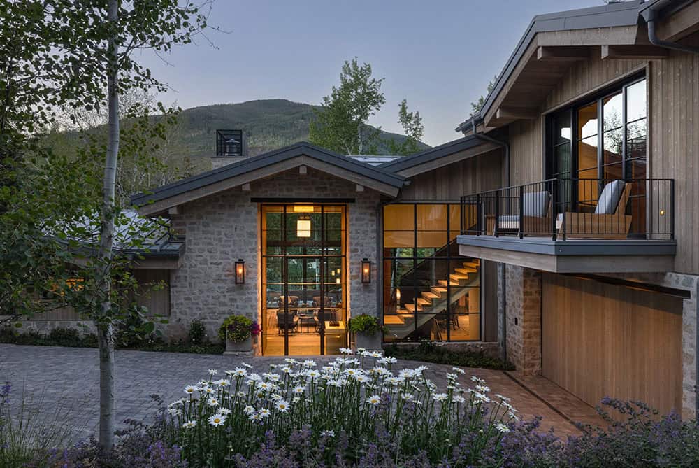 contemporary mountain home exterior at dusk