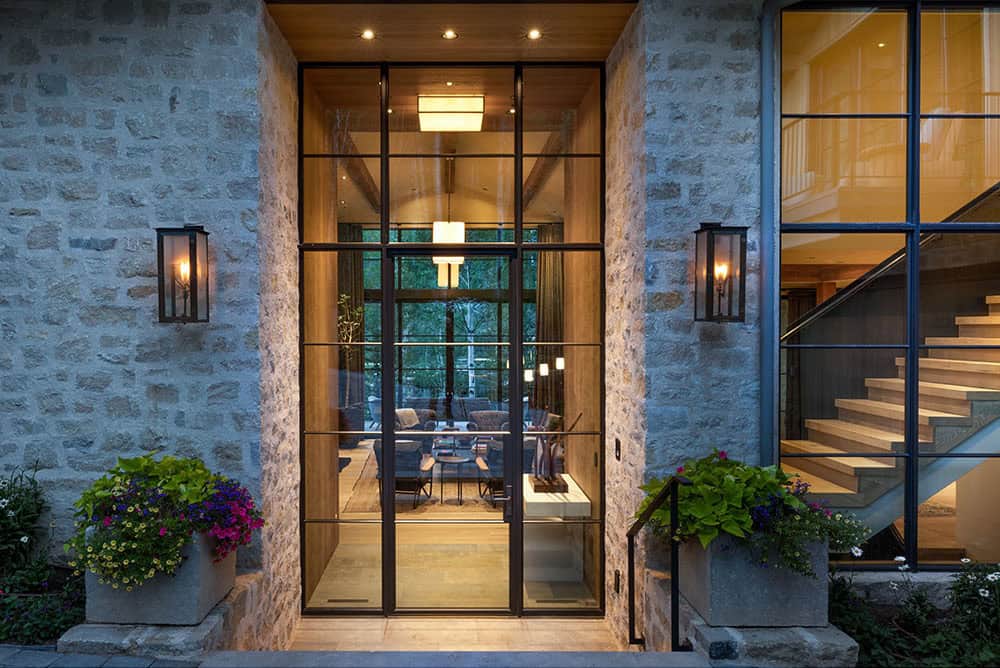 contemporary mountain home exterior entry at dusk