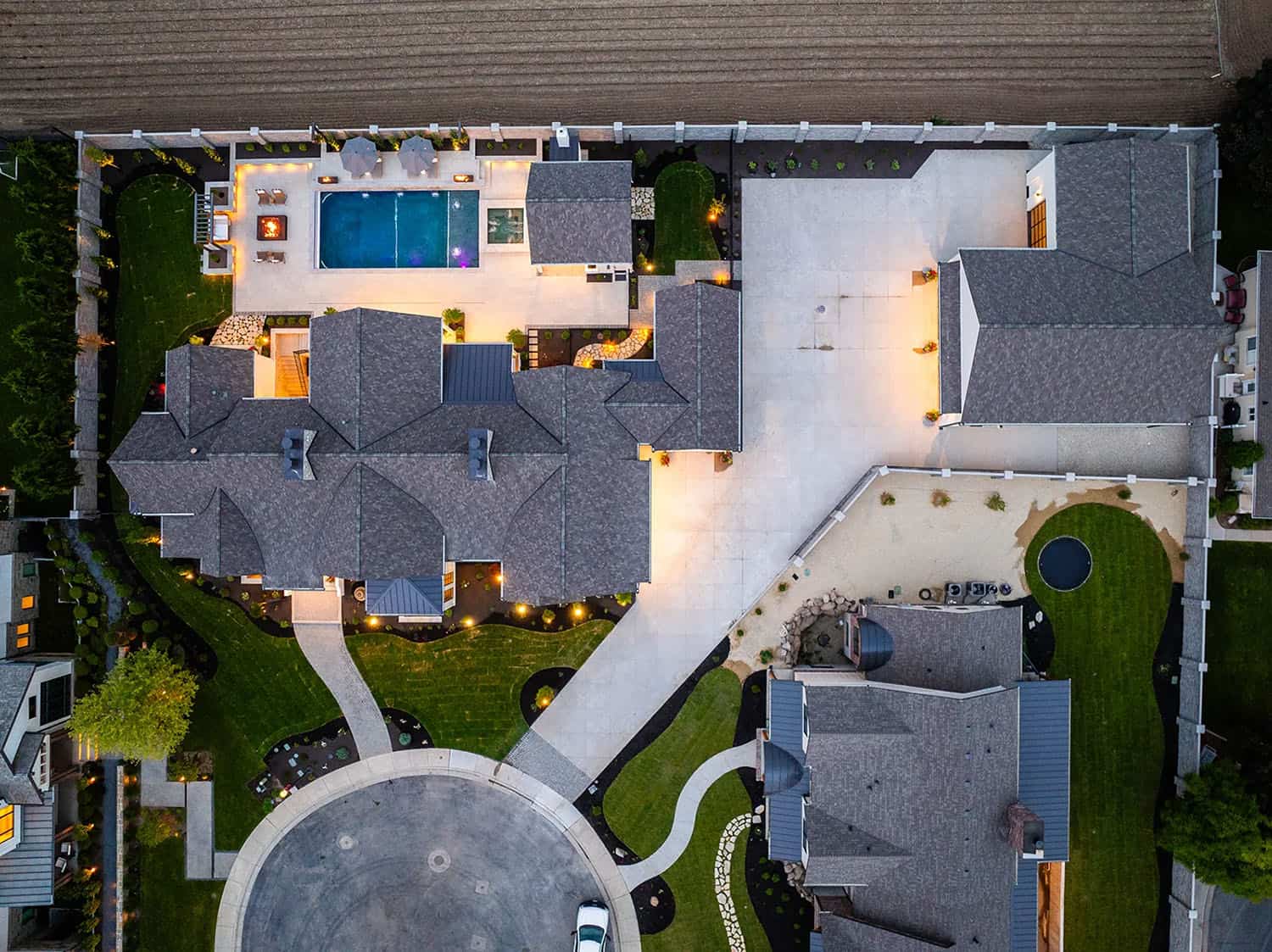 european style home exterior with a pool aerial view