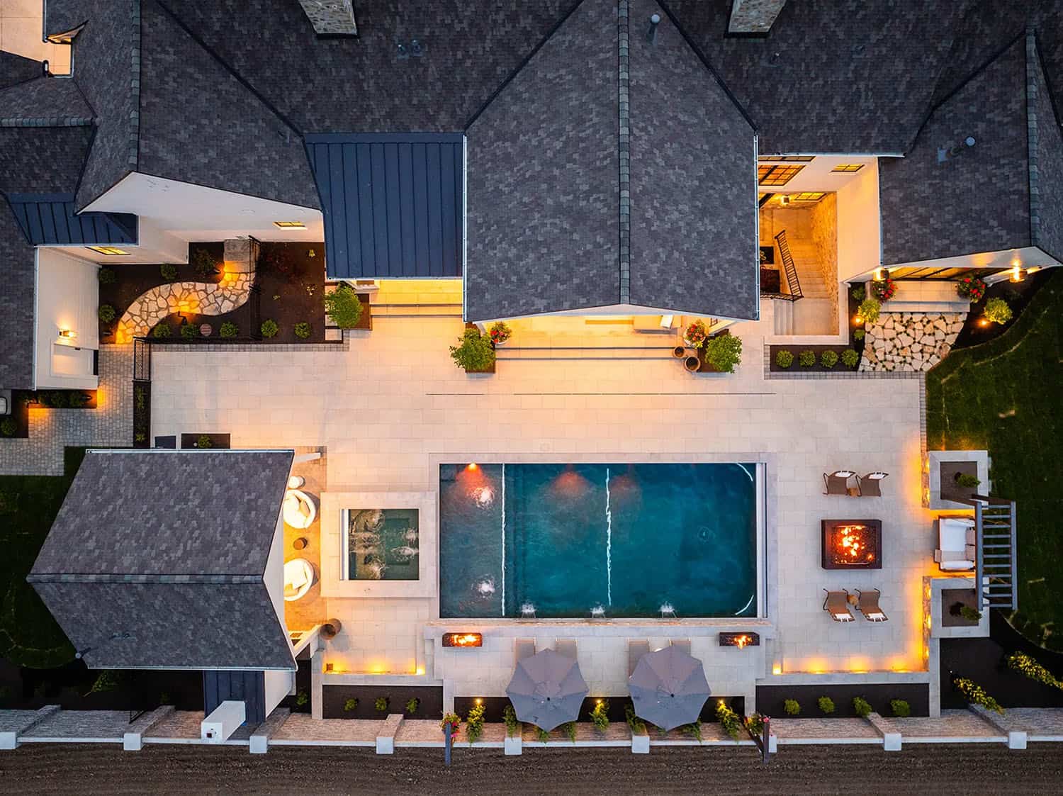european style home exterior with a pool aerial view