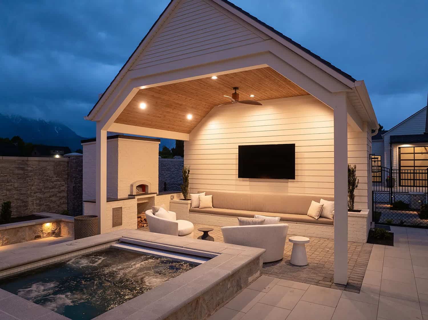 european style home exterior patio with a hot tub