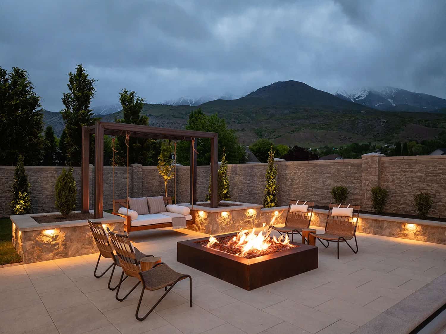 european style home exterior patio with a fire pit
