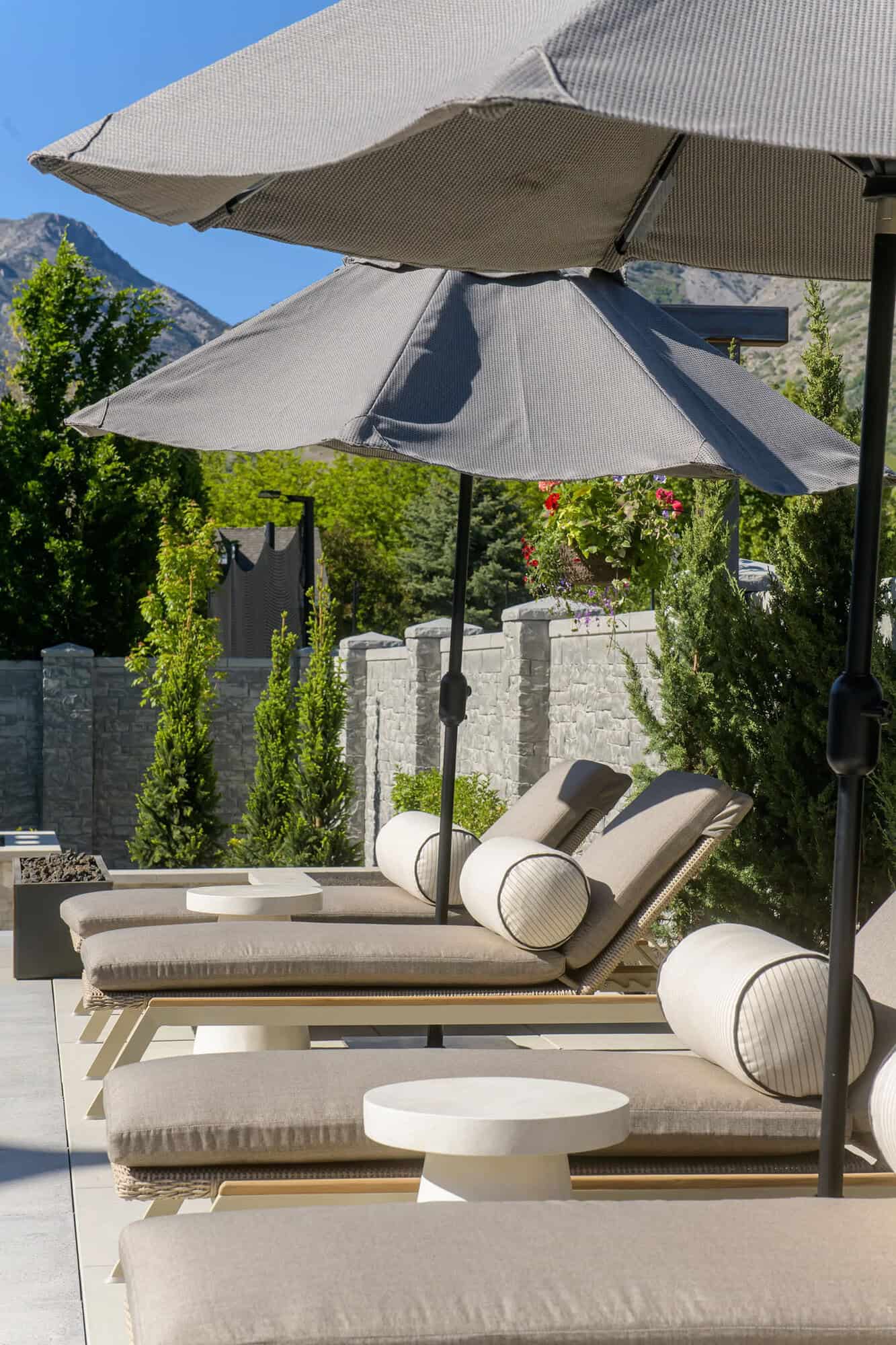 european style home exterior pool deck with lounge chairs