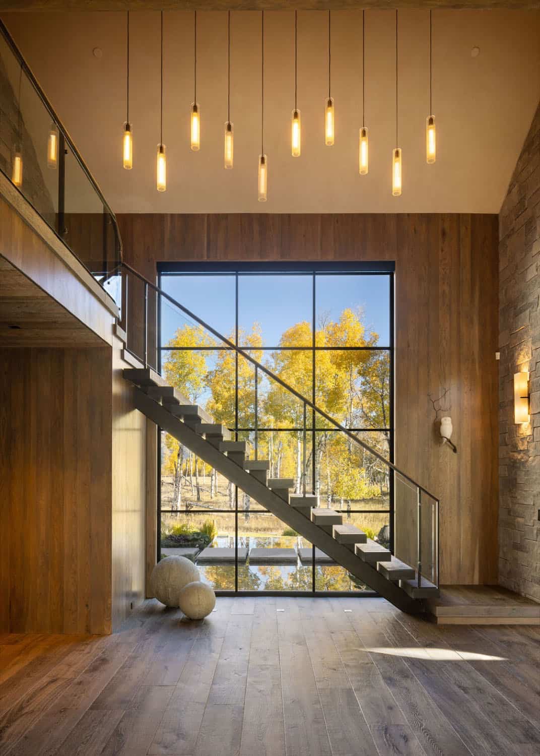 mountain home entry with a staircase and large window