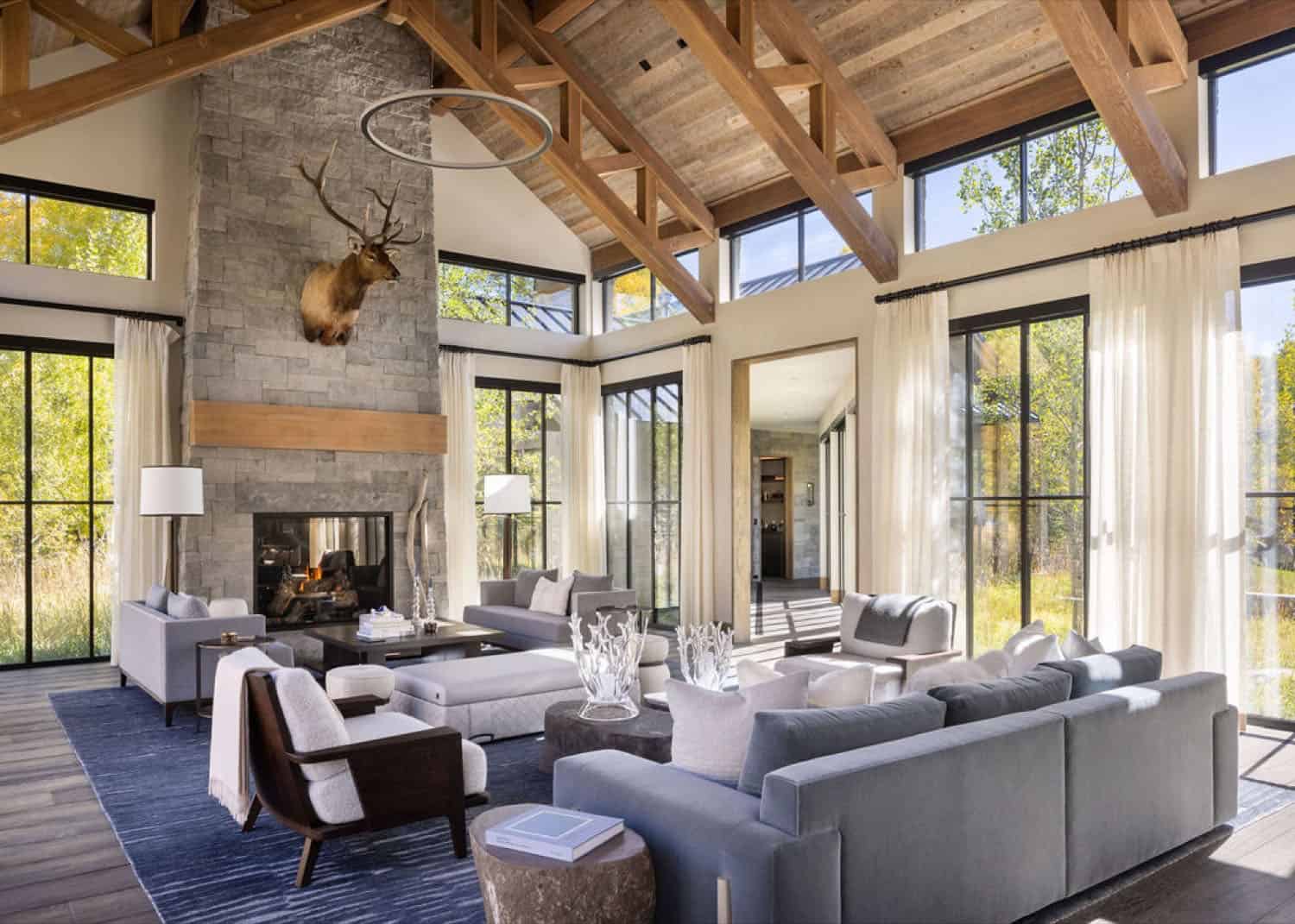 contemporary living room with a fireplace and vaulted ceiling