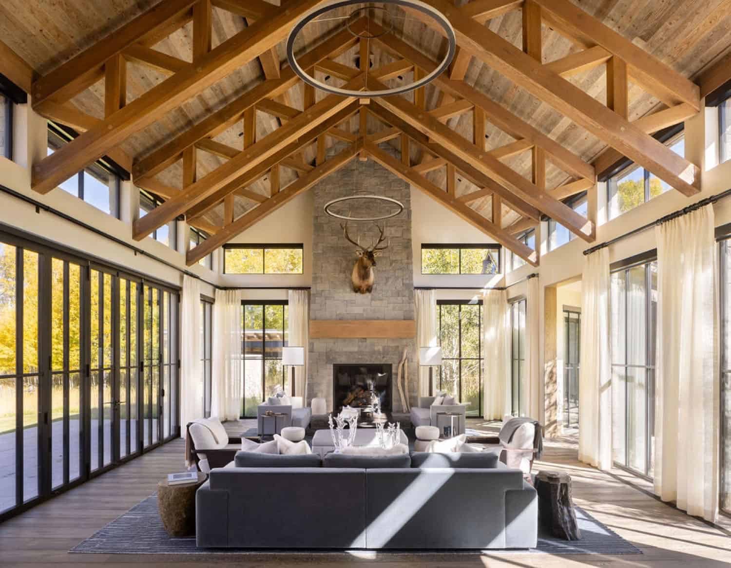 contemporary living room with a fireplace and vaulted ceiling