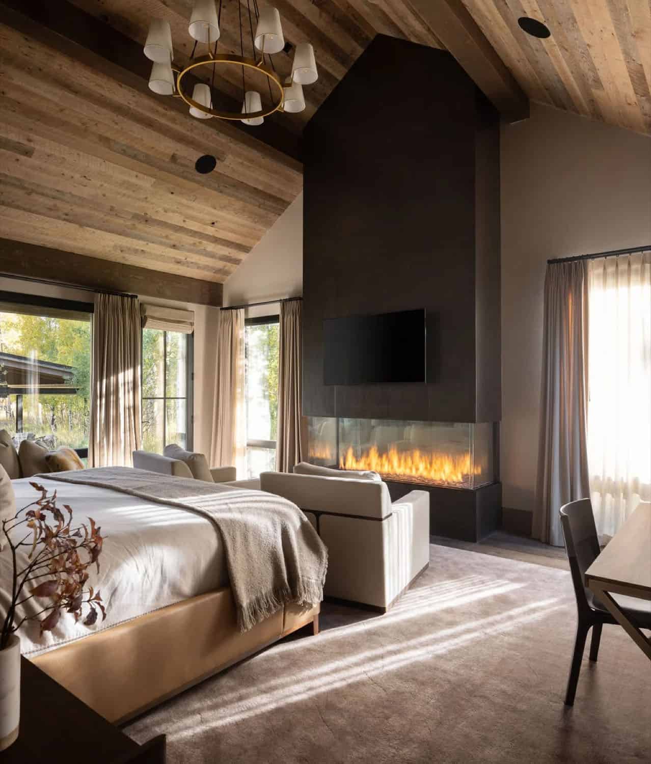 contemporary bedroom with a fireplace