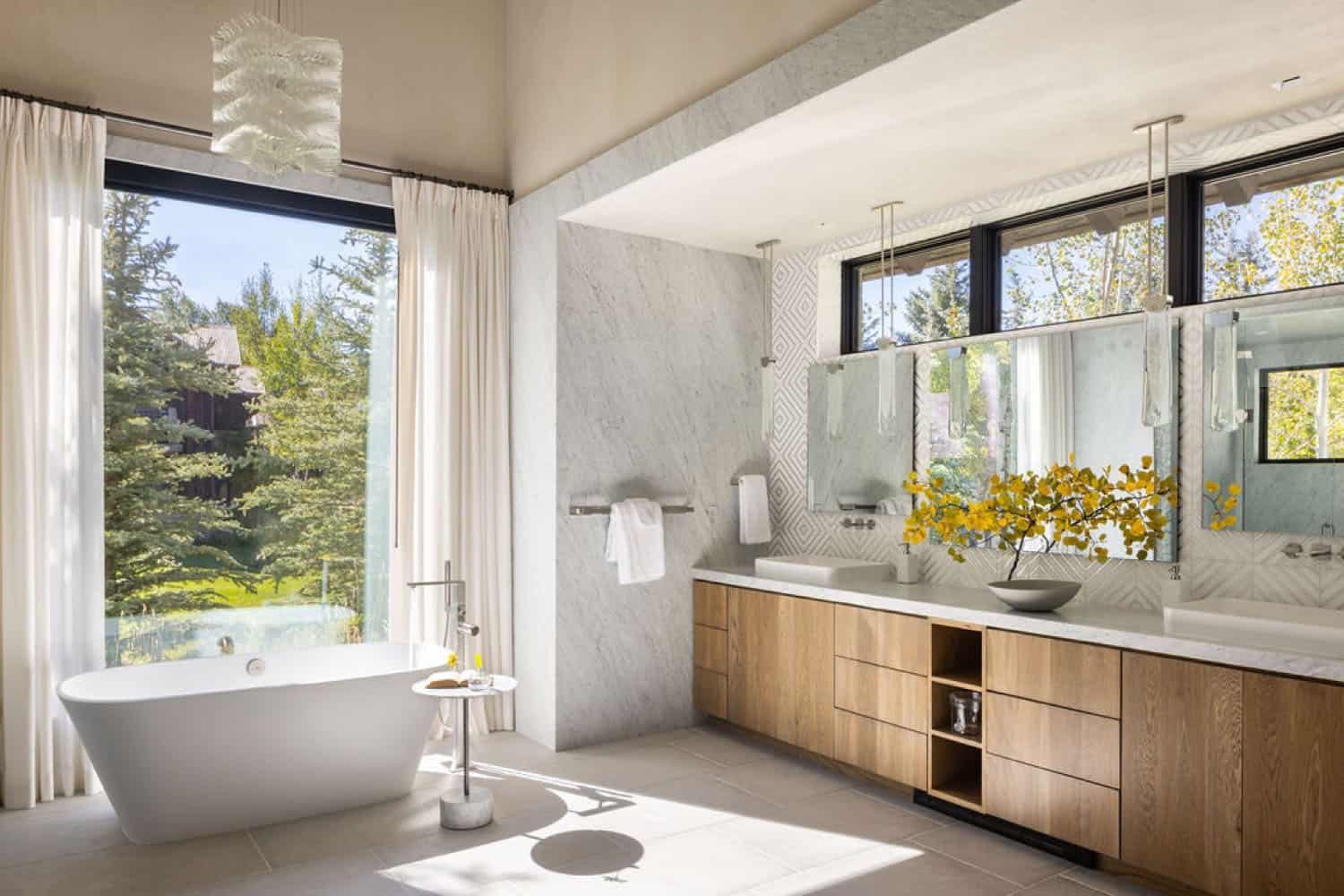 contemporary bathroom with a vanity and freestanding tub