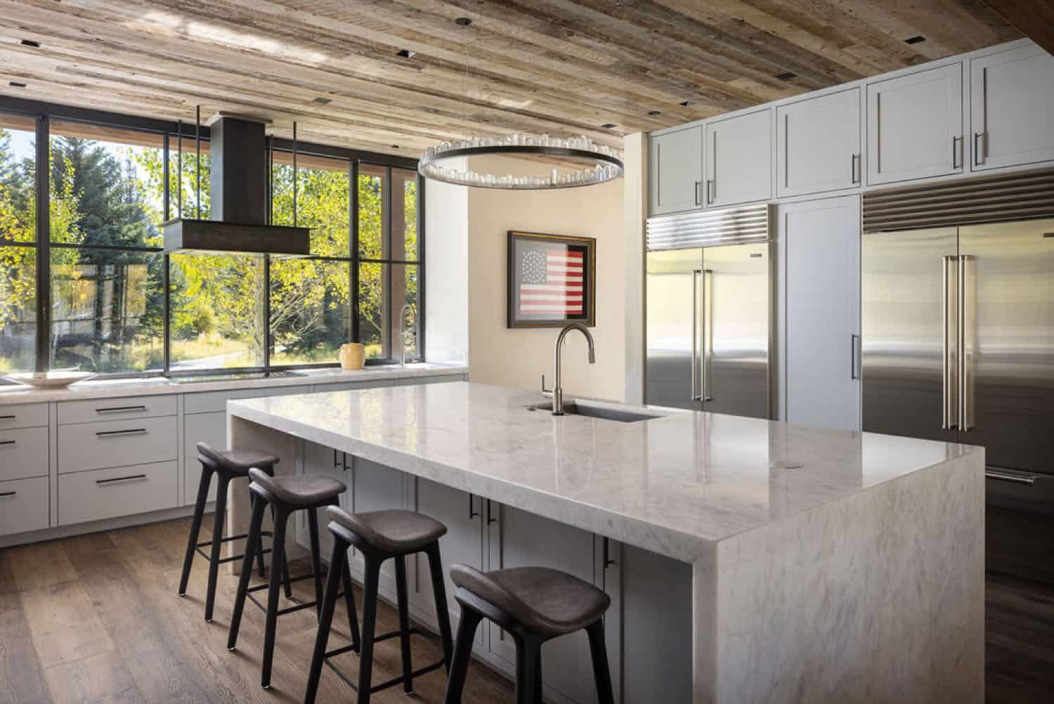 contemporary kitchen with a large island and counter stools