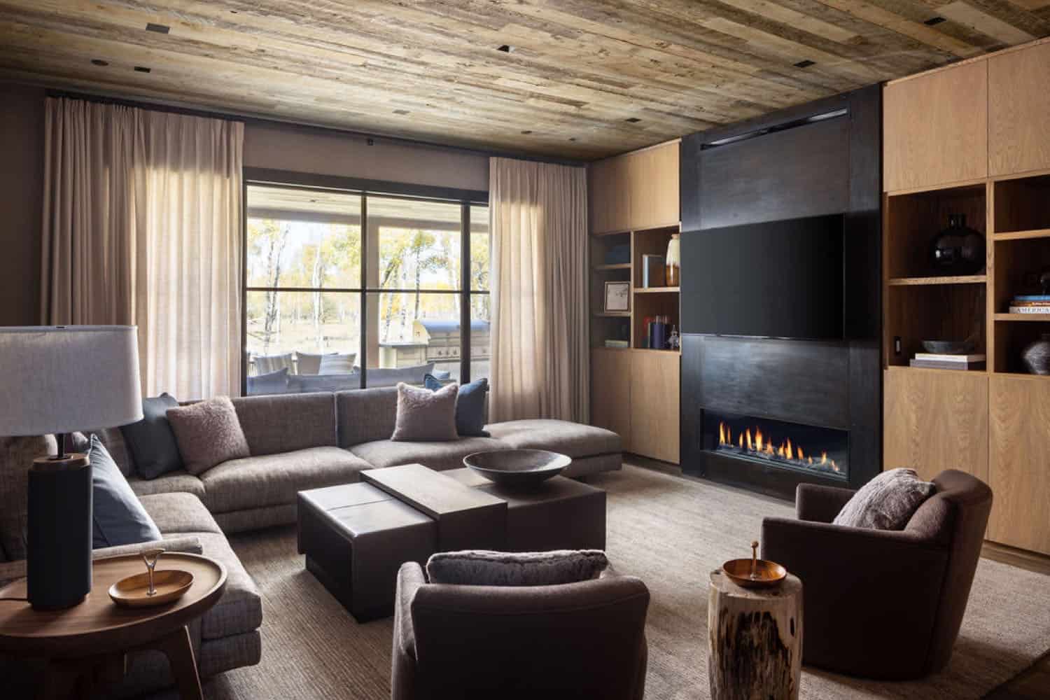 contemporary family room with a fireplace