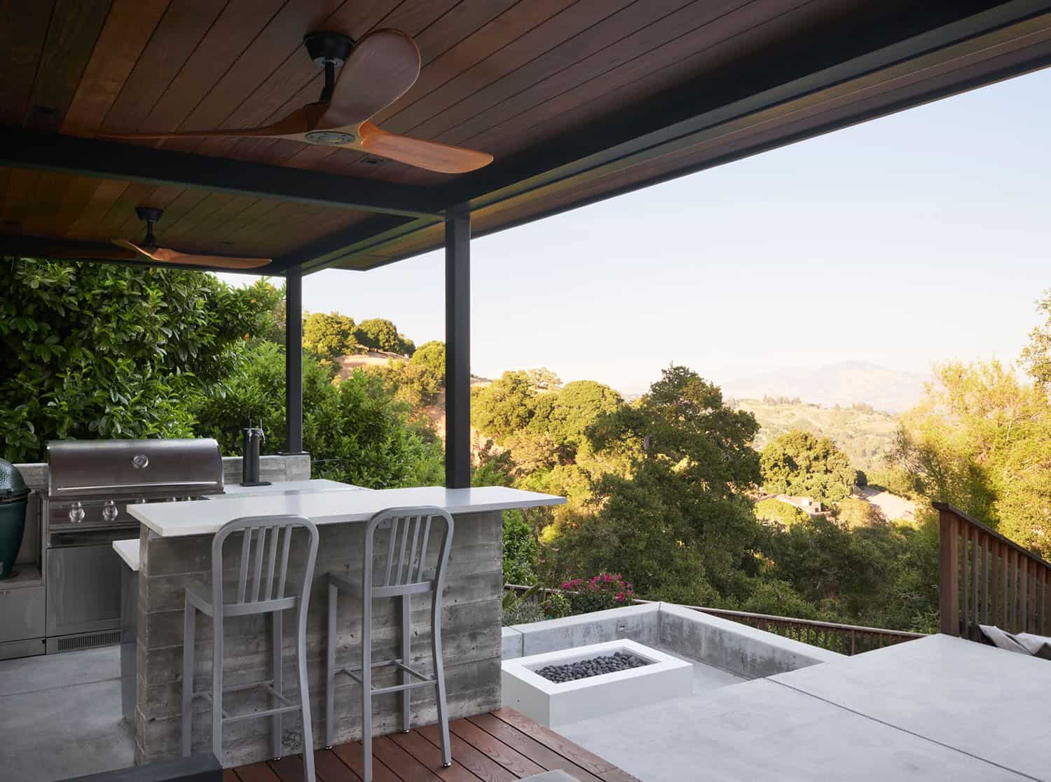 midcentury modern home exterior with a covered porch and built-in grill
