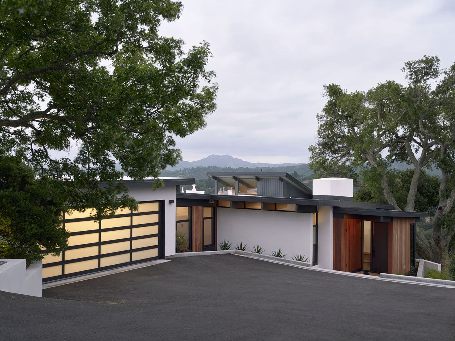 midcentury modern home exterior at dusk