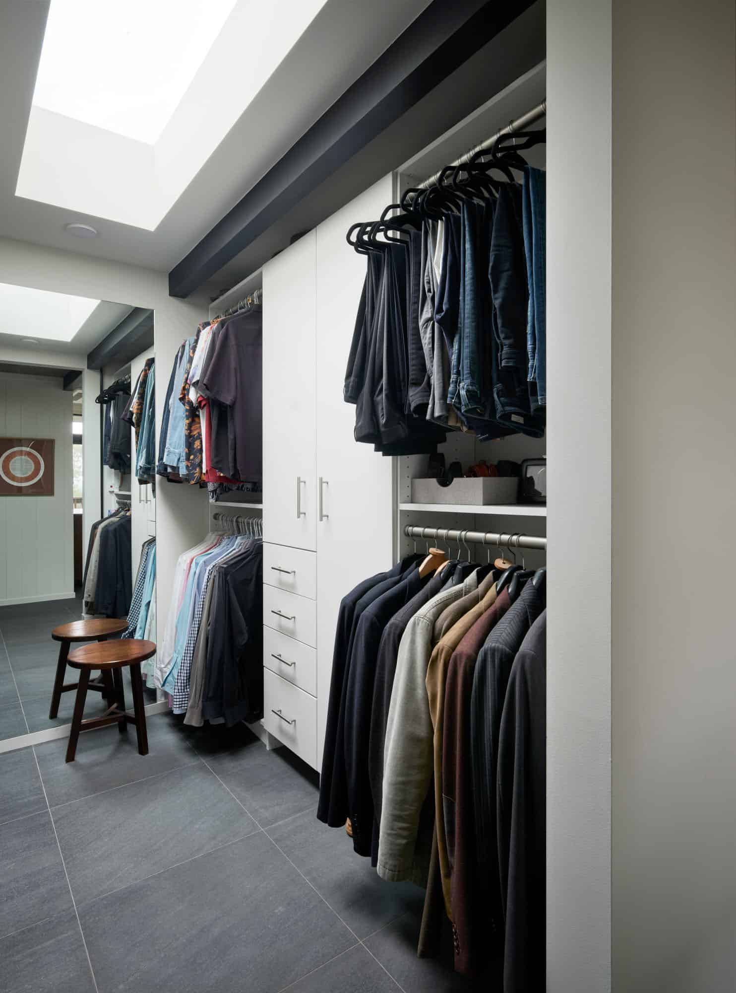 midcentury modern walk-in closet with skylights