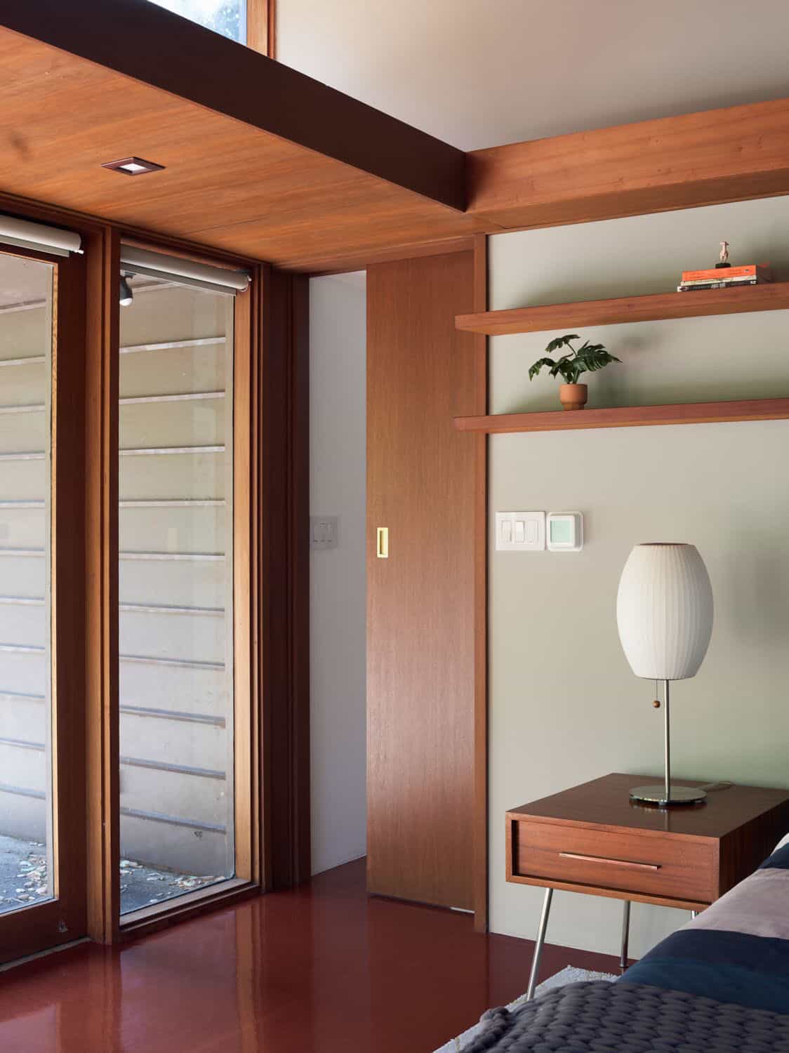 midcentury modern bedroom with sliding glass doors