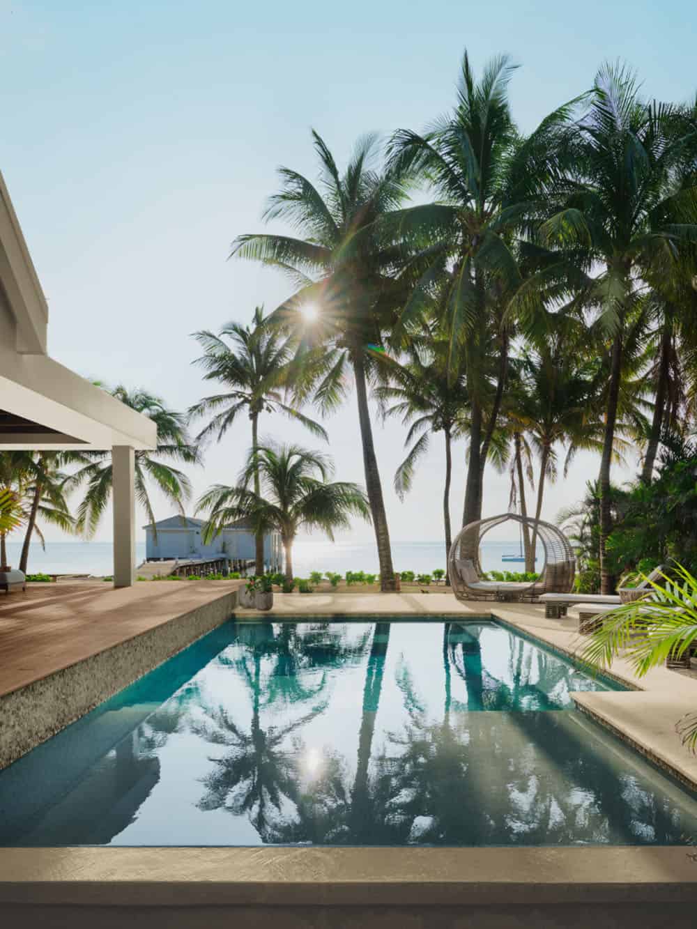 modern coastal home exterior with a pool