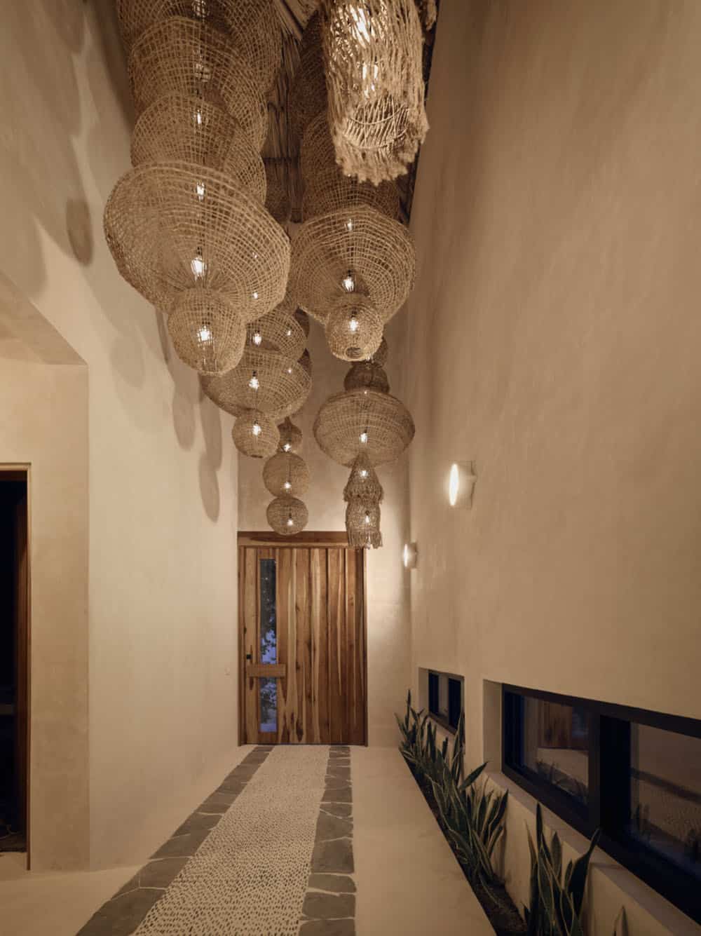 modern coastal home entry with large light fixtures