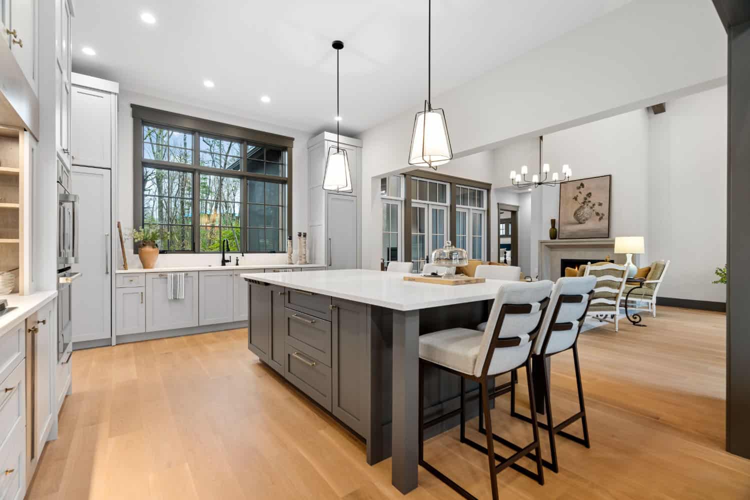 modern kitchen with pendant lights and a window