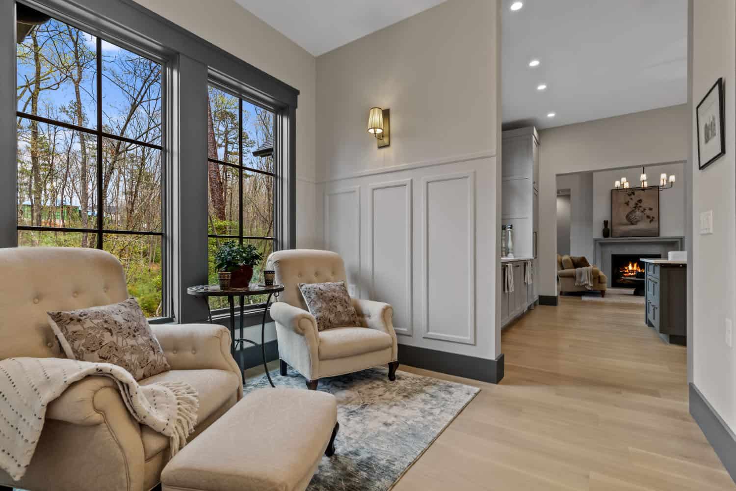 hallway sitting area with two chairs and a large window