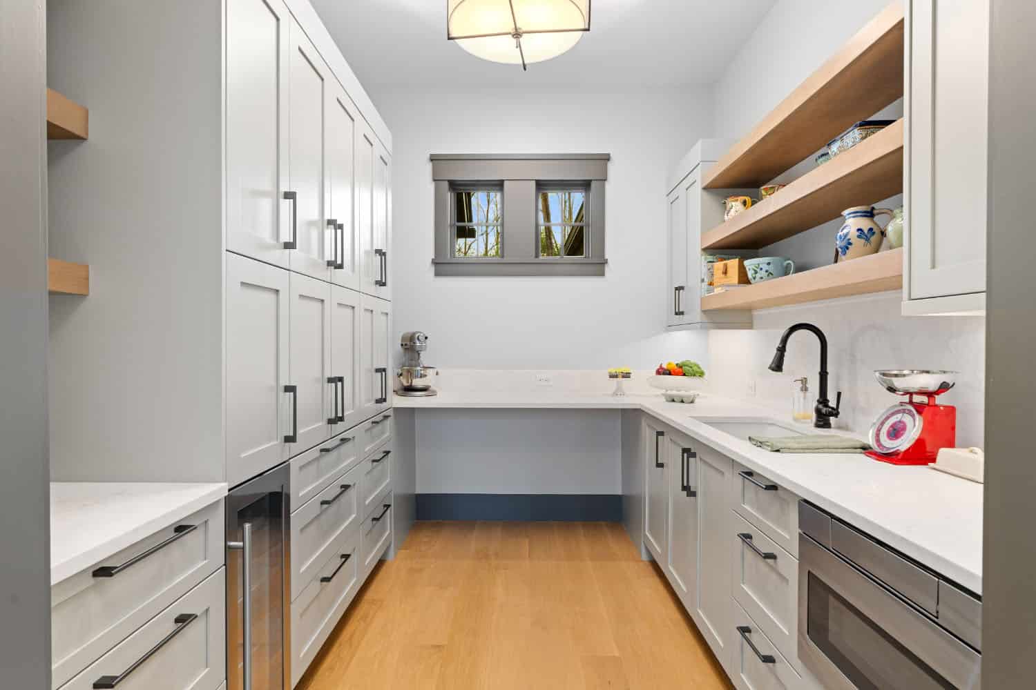 large walk-in pantry with a small window