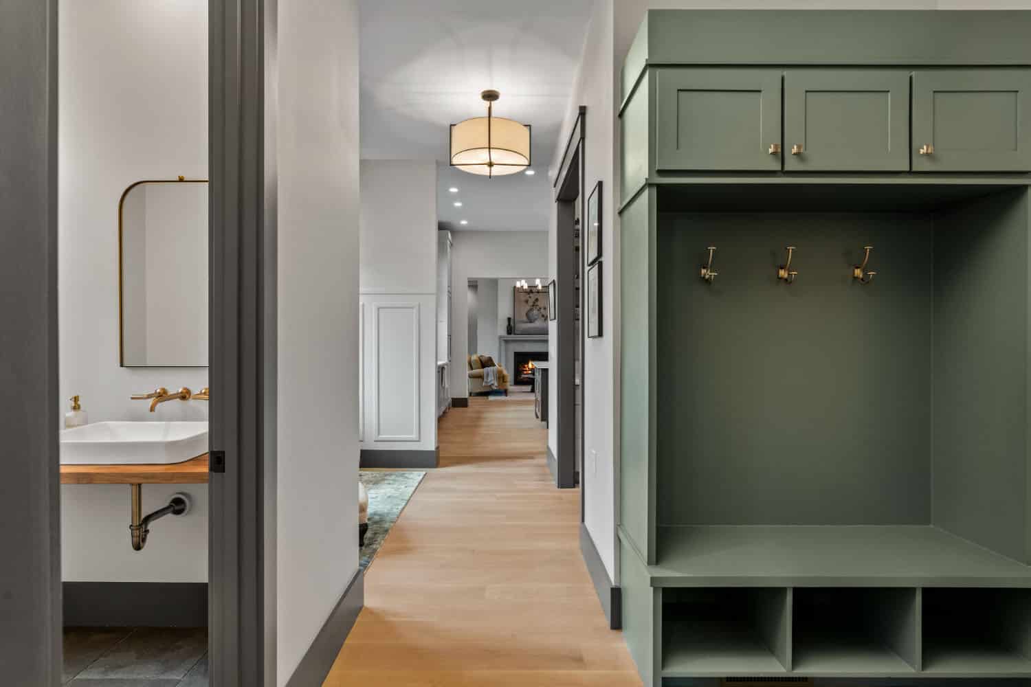 hallway with a mudroom and powder room