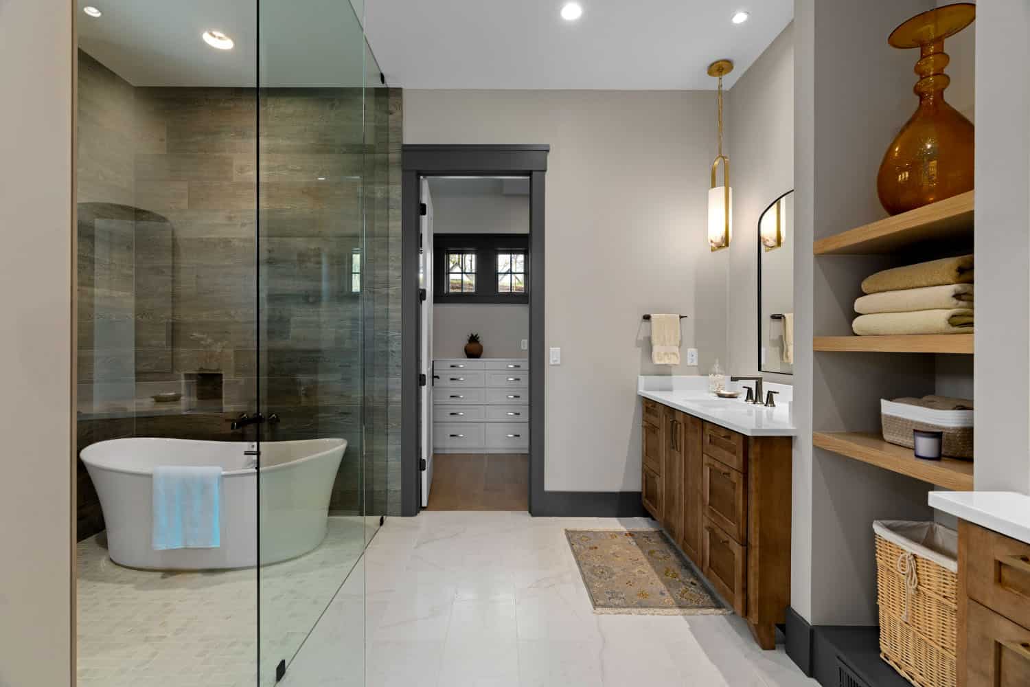 modern bathroom with a vanity and shower/tub combo