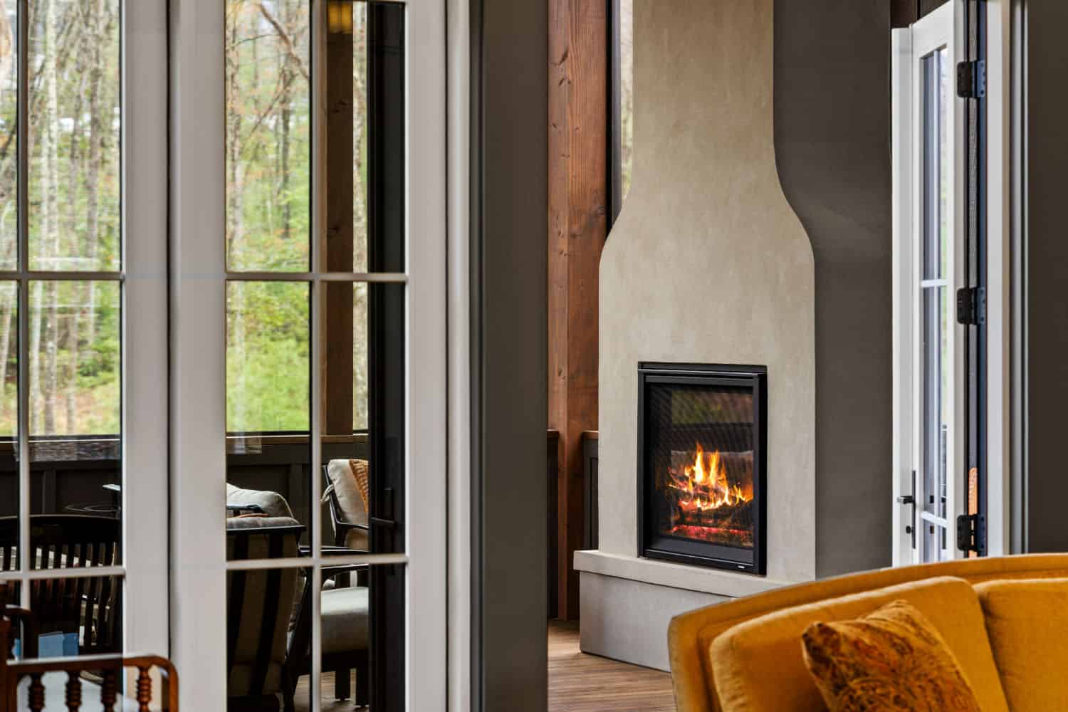 modern screened porch with a fireplace