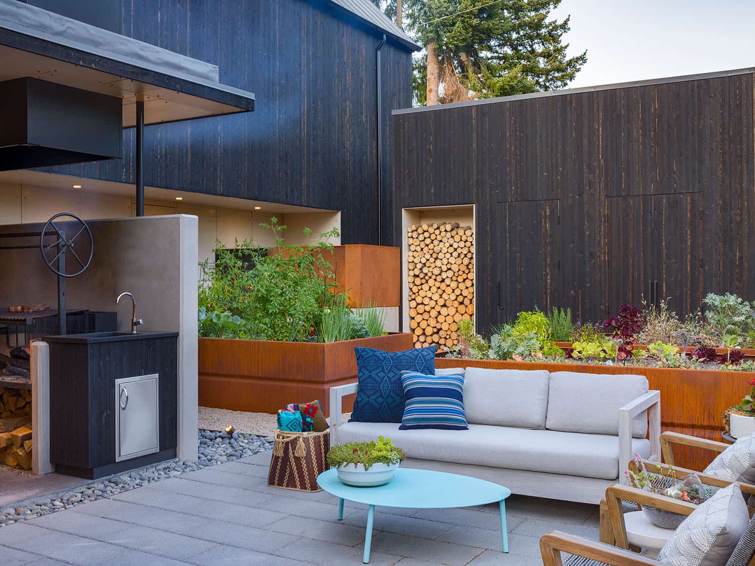 modern home exterior with a patio and outdoor furniture