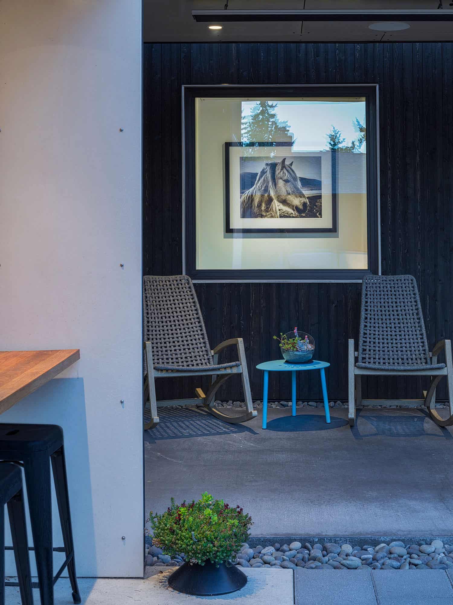 modern covered patio with rocking chairs