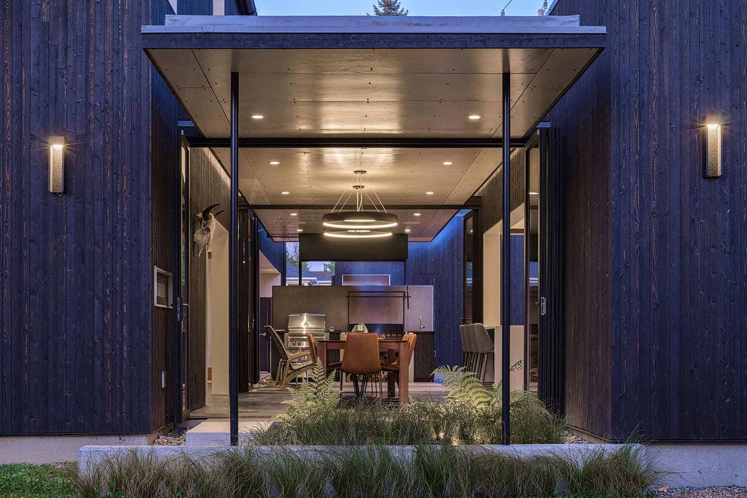 modern dining room with folding glass walls