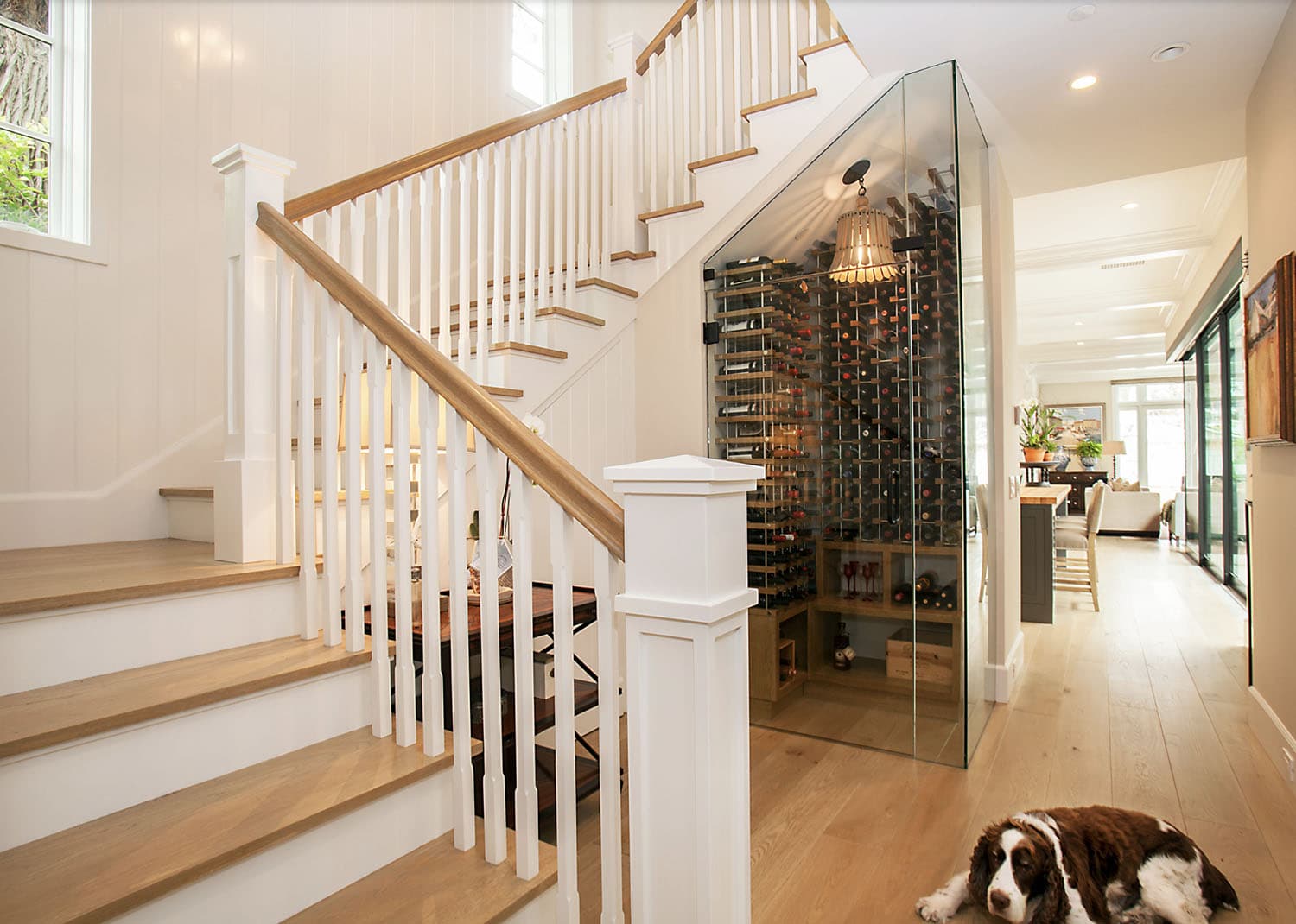 modern farmhouse style staircase with an under stair wine cellar