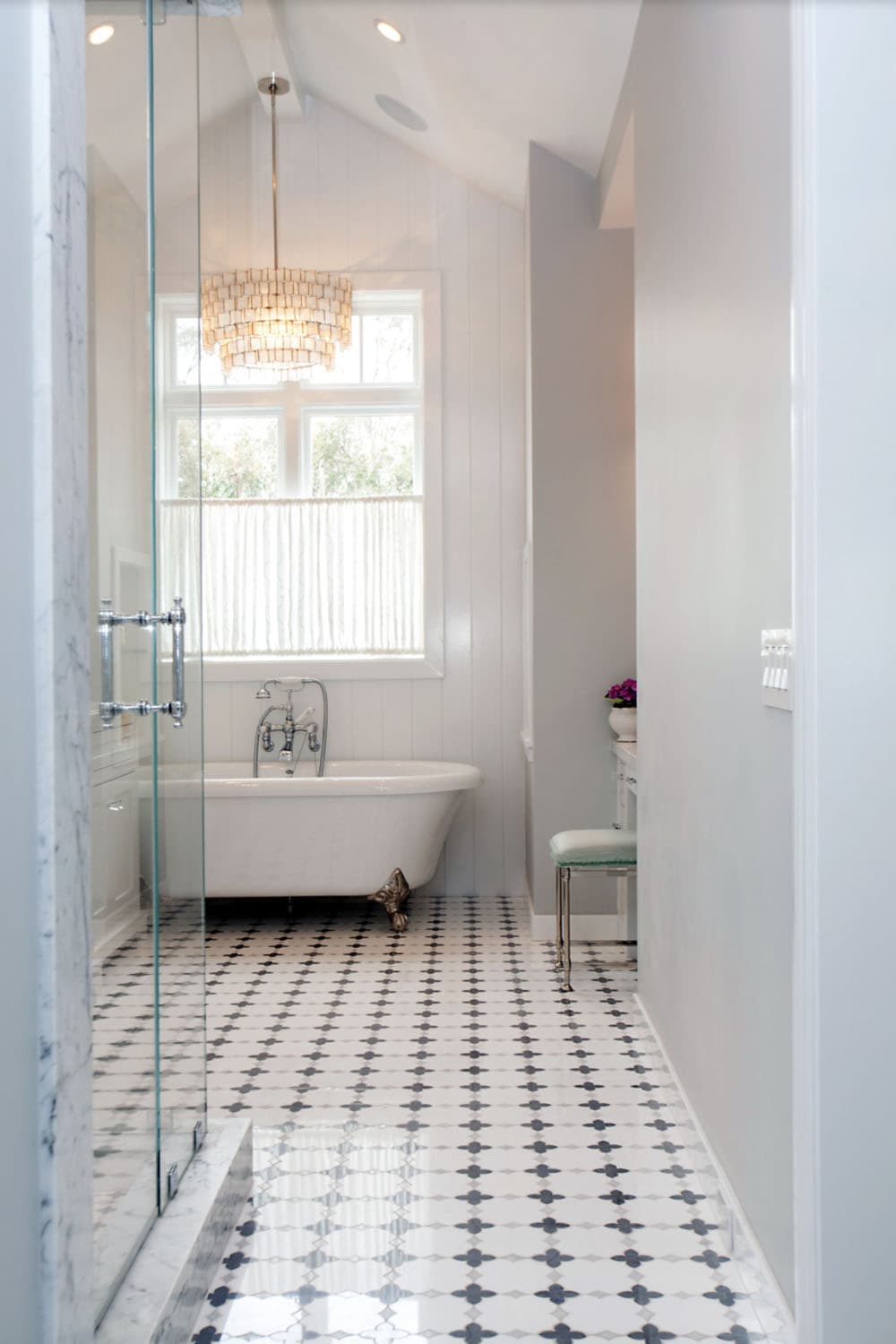 transitional style bathroom with a freestanding tub
