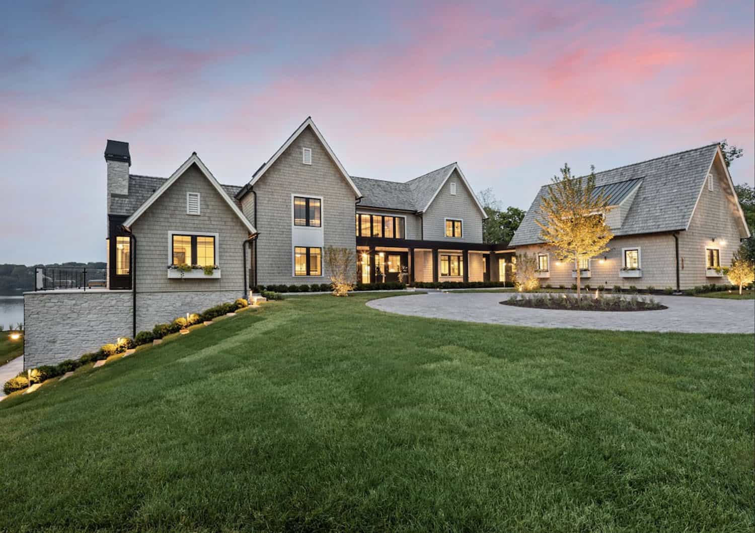 modern lake house exterior at dusk