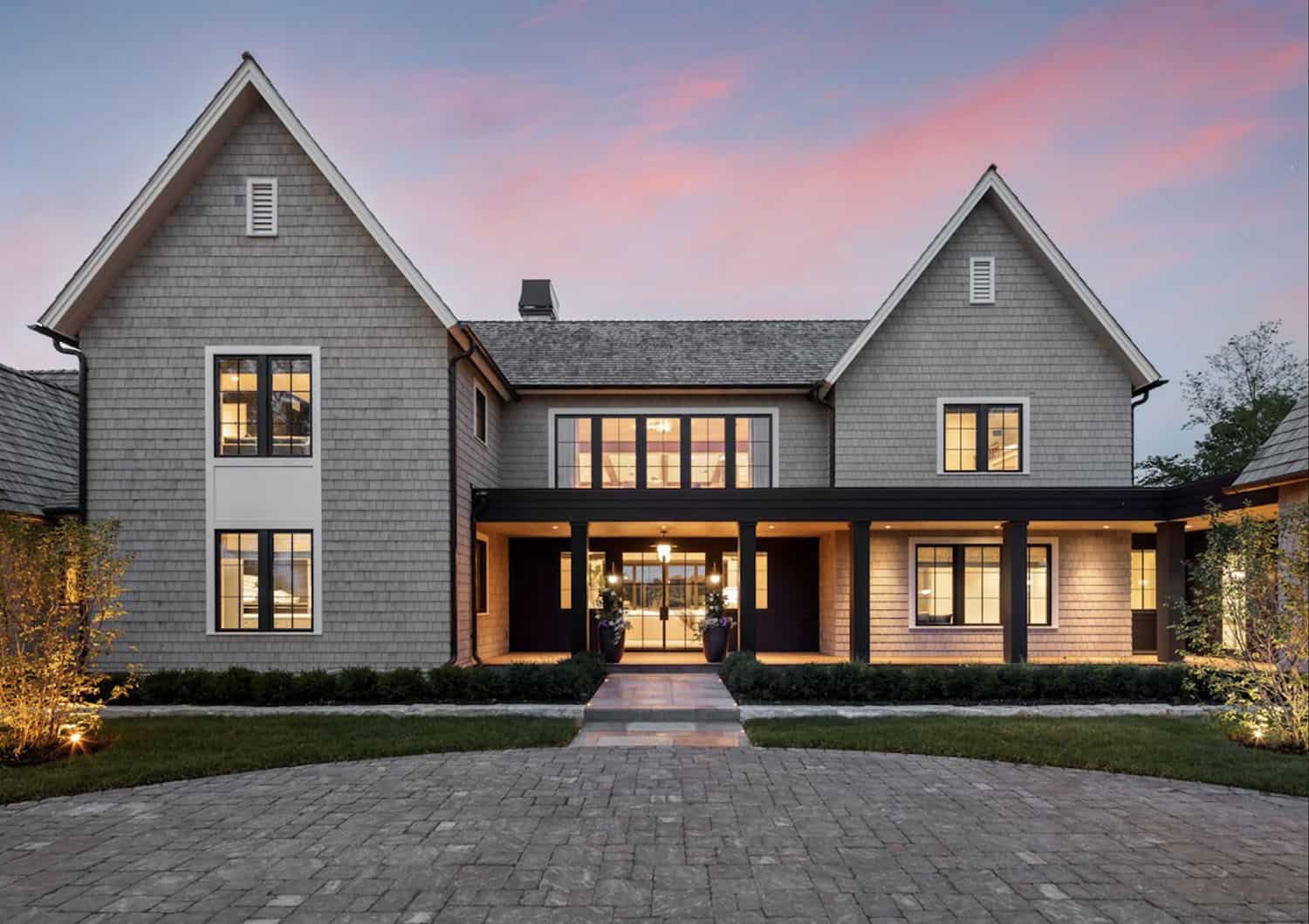 modern lake house exterior at dusk
