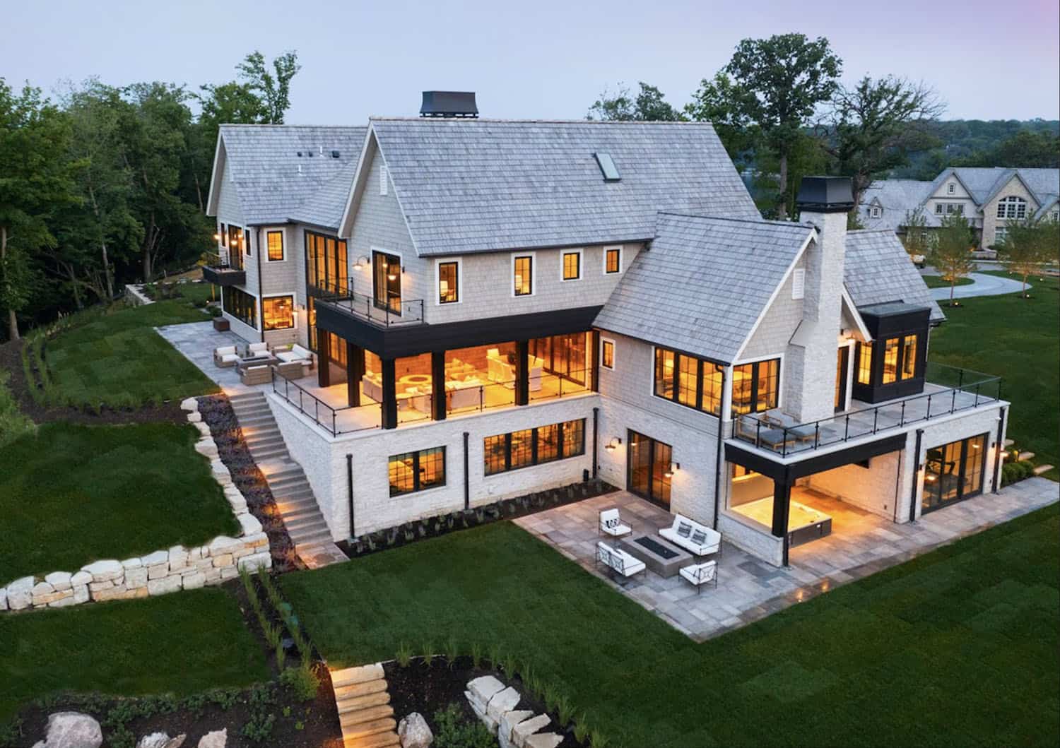modern lake house exterior backyard view
