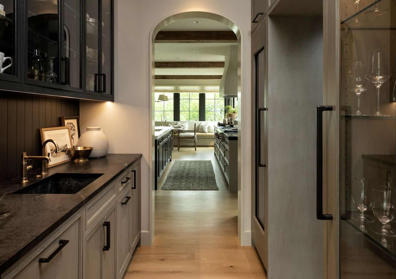 modern walk-in pantry with a rolling ladder