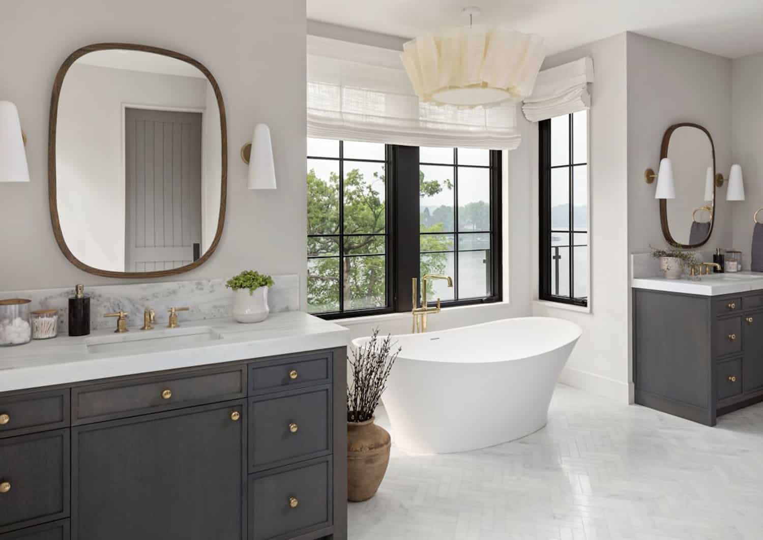 modern bathroom with dual vanities and a freestanding tub
