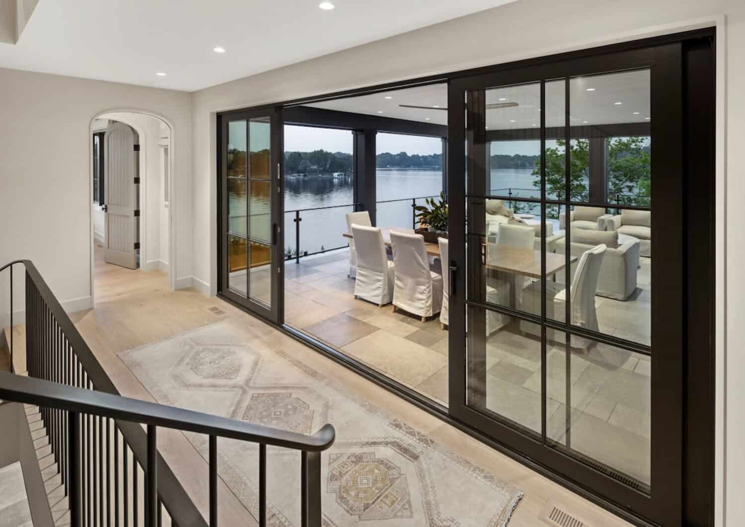 modern hallway with a sliding glass door leading out to the covered patio