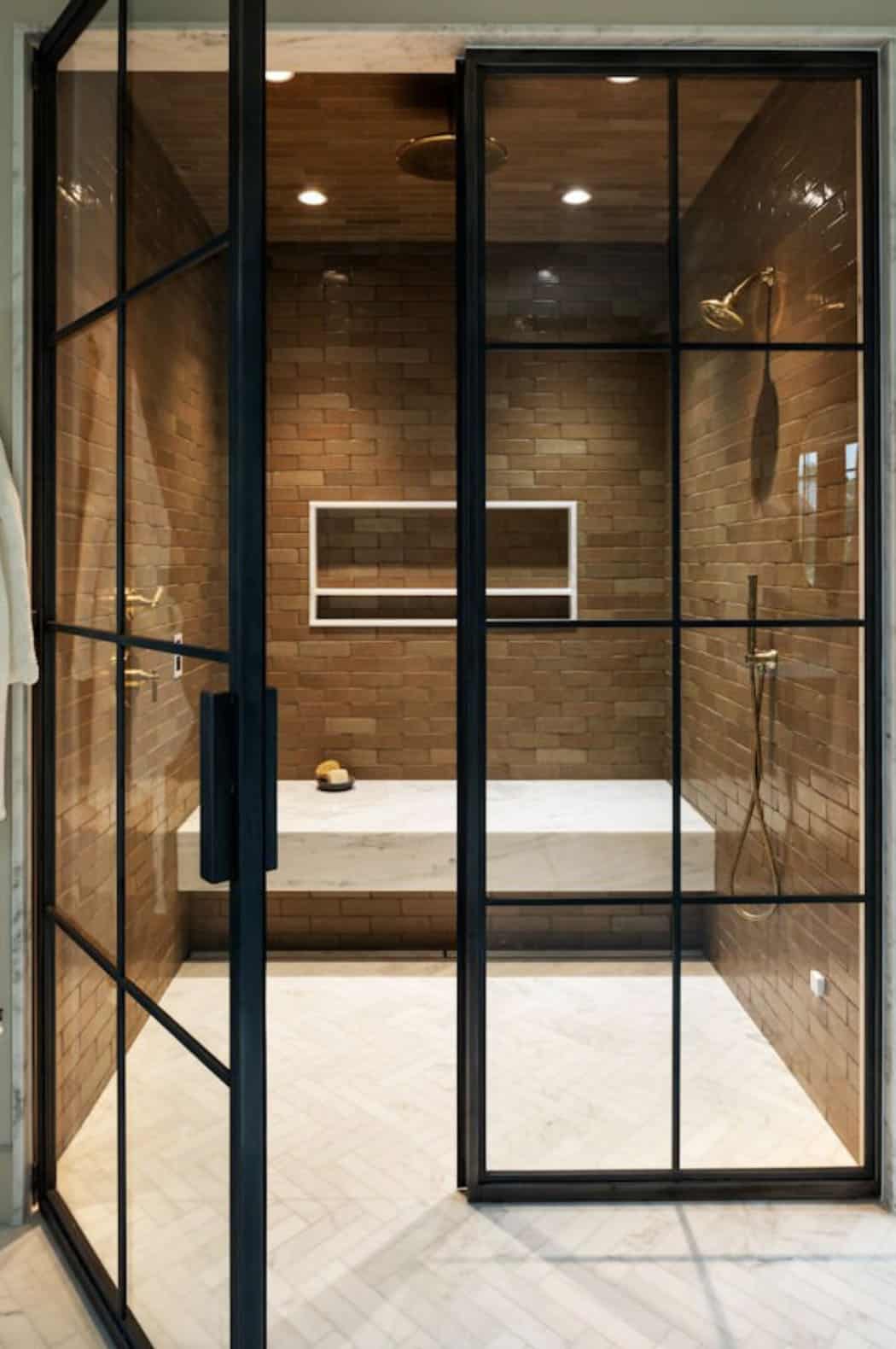 modern bathroom with a shower and built-in bench