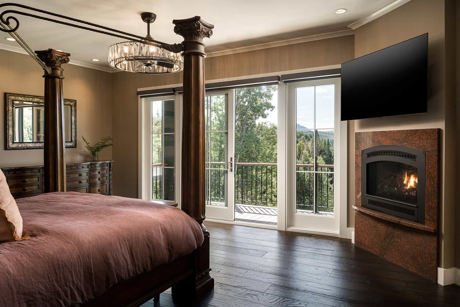 A living room with a large window and wooden floors