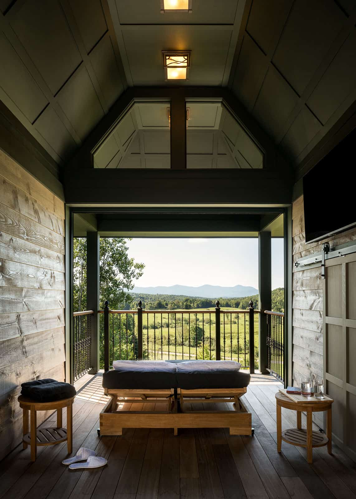 covered porch with a lounge chair and a view of the landscape
