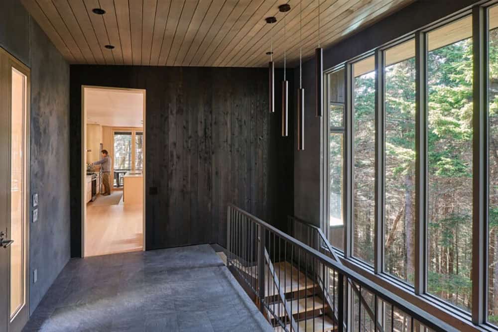 modern mountain cabin exterior entry bridge