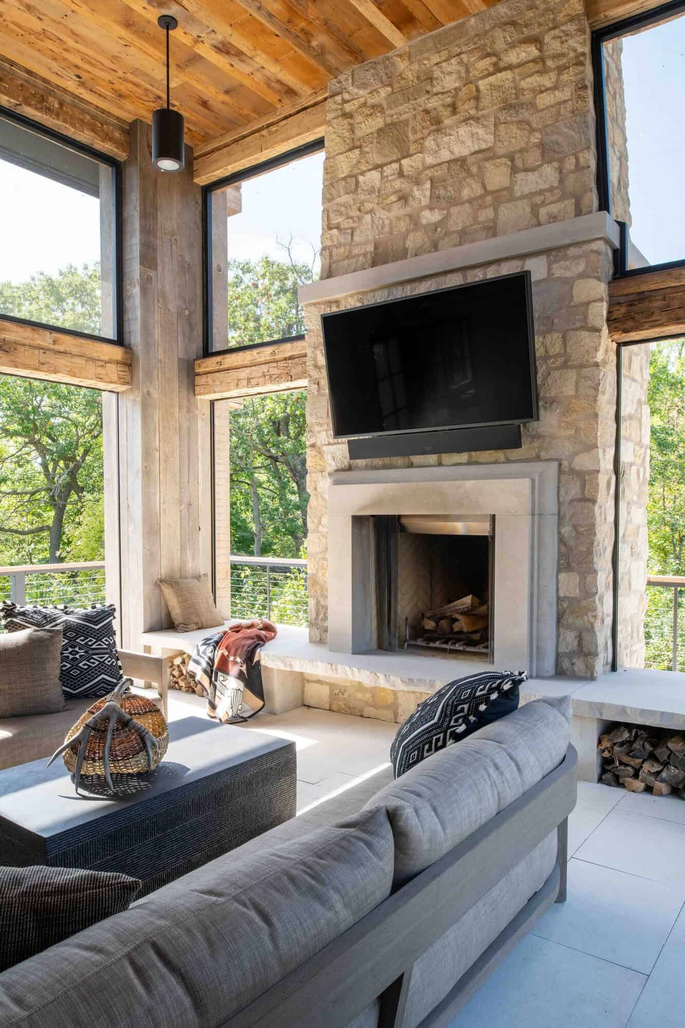 modern modern screened porch with a fireplace
