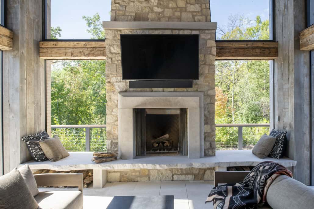 modern modern screened porch with a fireplace