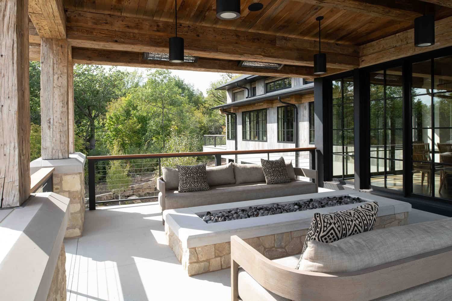 modern modern covered patio with outdoor furniture and a fire pit