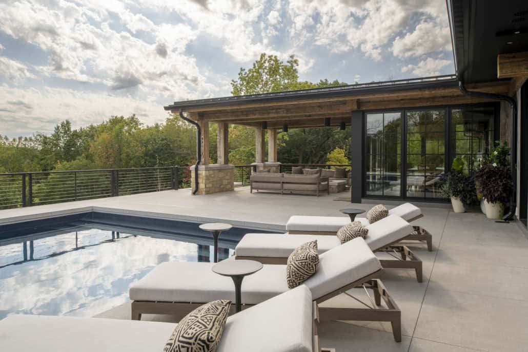 modern modern home exterior patio with chaise lounges