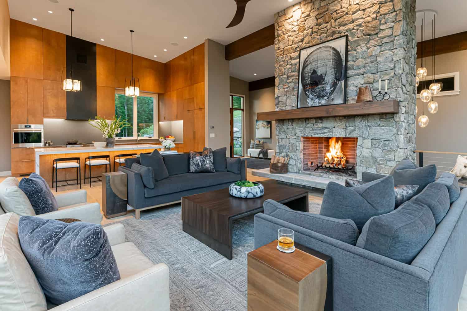 modern living room with a stone-clad fireplace
