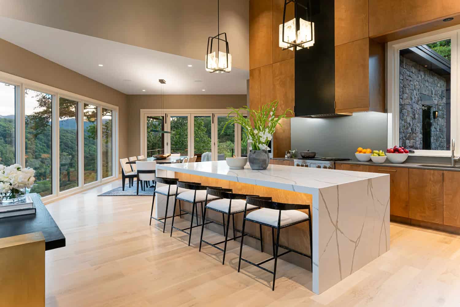 modern kitchen with a large island and pendant lights