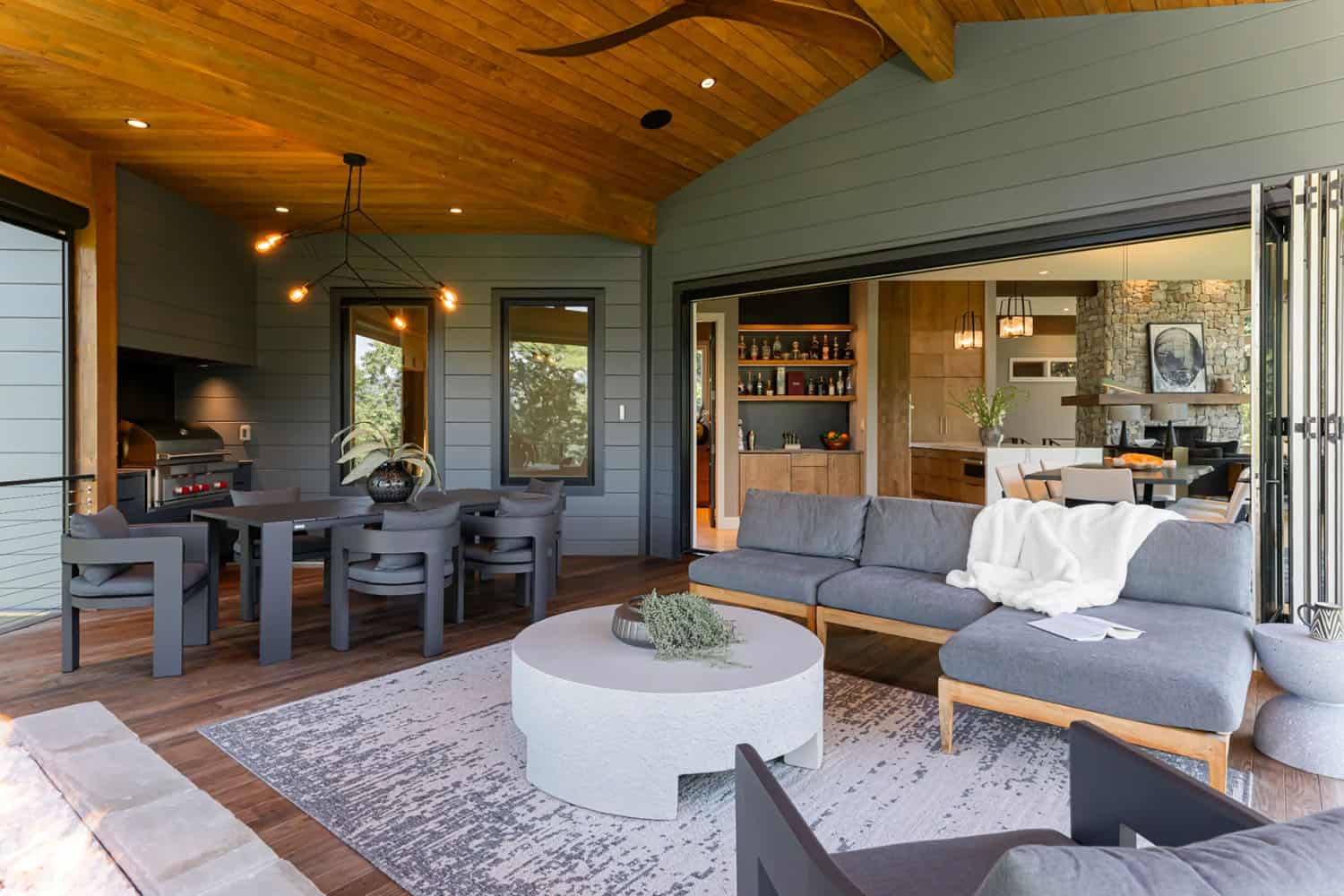 modern covered porch with outdoor furniture
