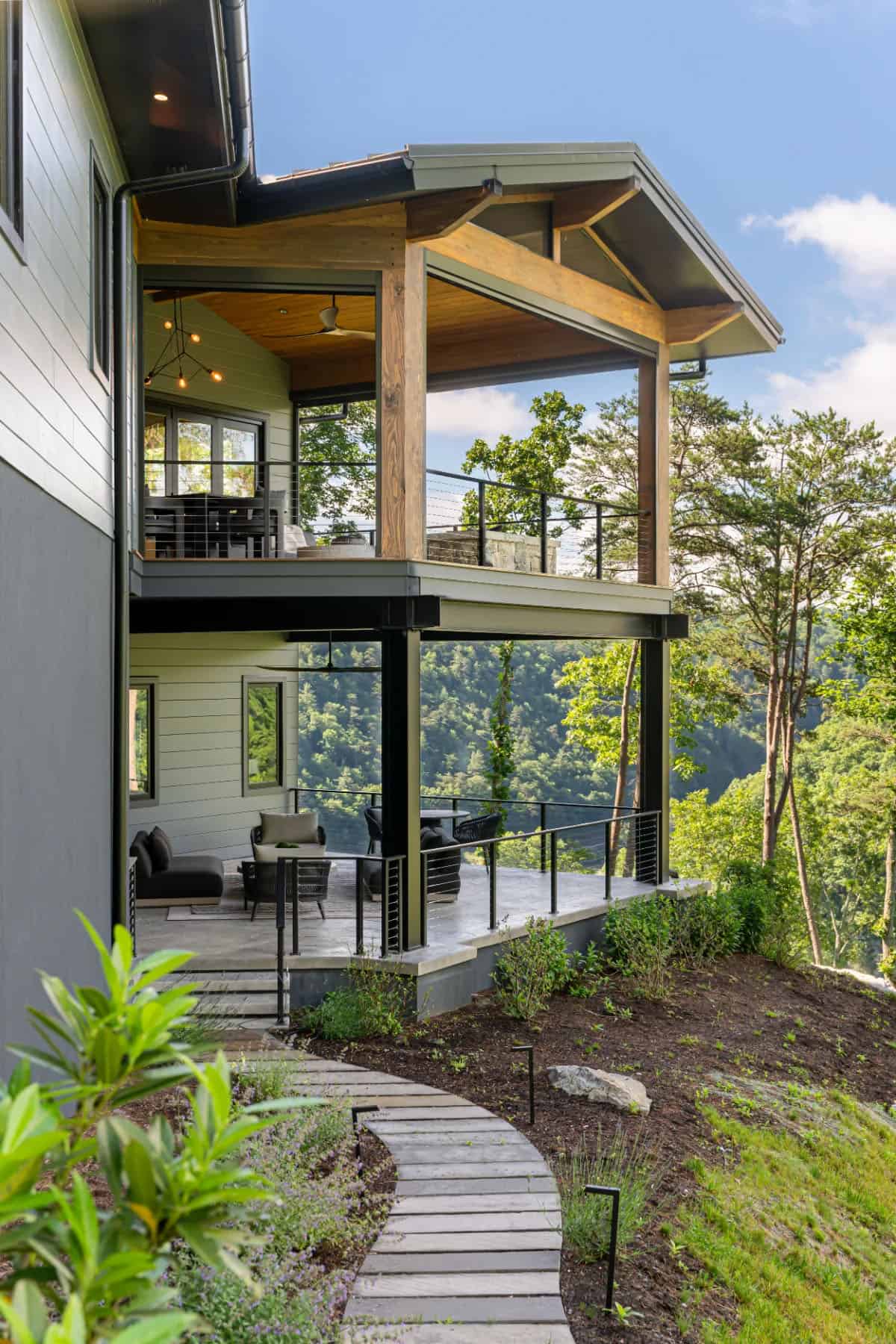 modern mountain home exterior with a pathway