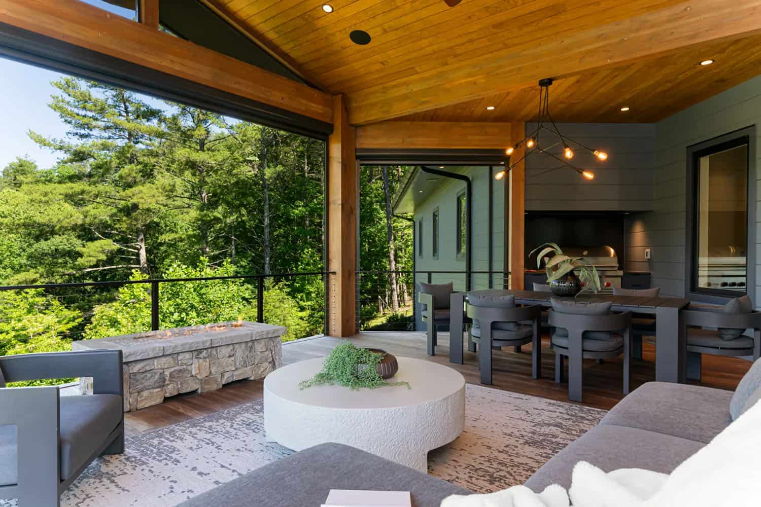 modern covered porch with outdoor furniture